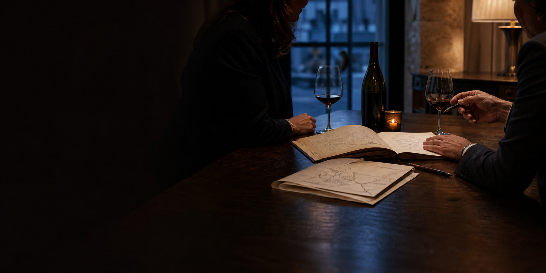 A private wine advisor and client reviewing a cellar report and journey plan